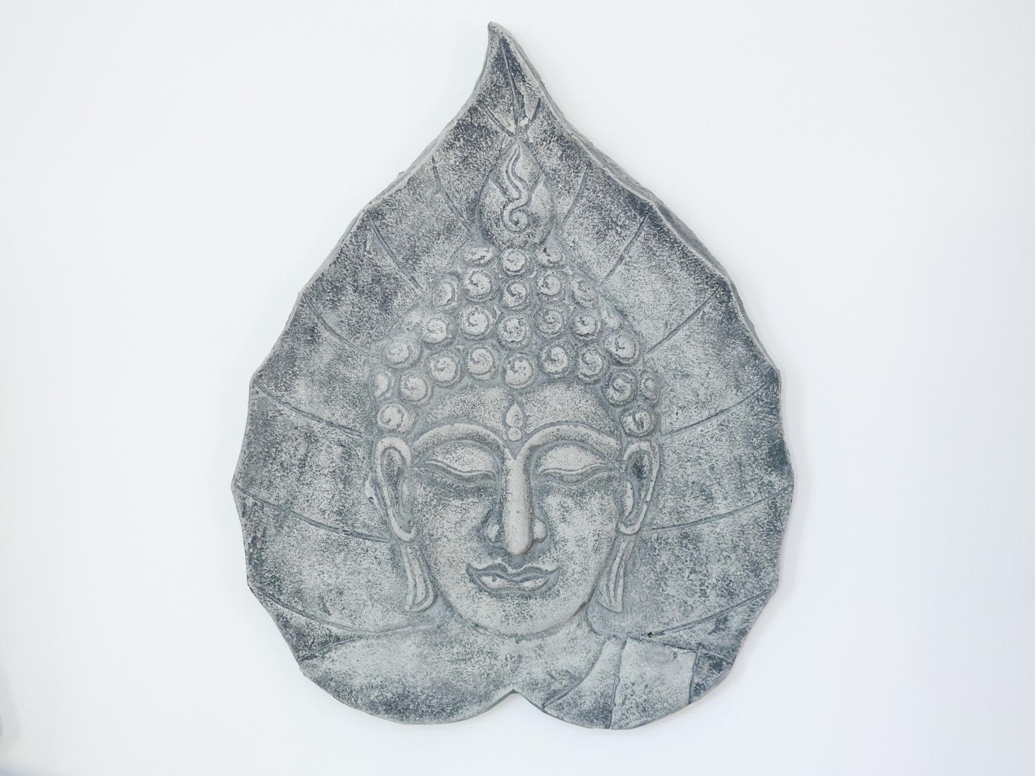 Buddha-Relief in den Räumen der Praxis für Naturheilkunde
